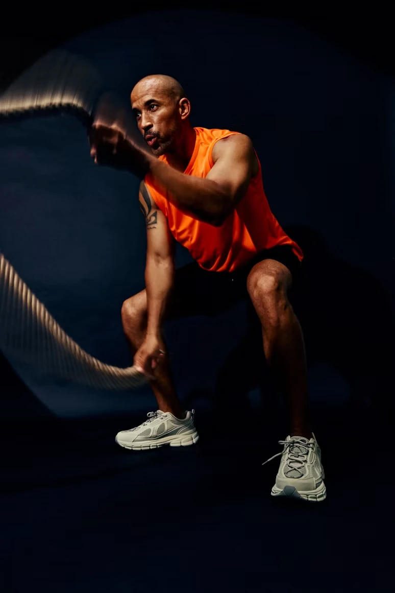 A creator training with battle ropes